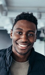 Patient in Studio City smiling with their dental crowns