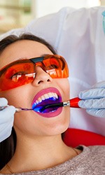 Woman having tooth-colored filling put in place