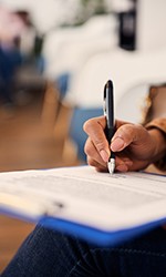 Patient in Studio City filling out paperwork for a root canal