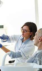  Patient in Studio City talking to dentist about a root canal